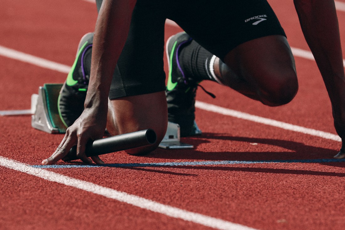 Runners competing on an athletics track
